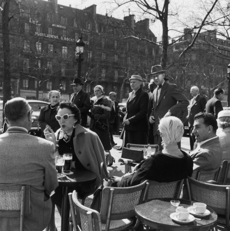 30th April 1956:  A crowded street cafe in Paris on a hot spring day.  (Photo by John Sadovy/BIPs/Getty Images)