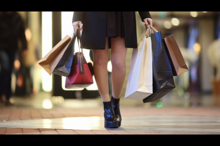 Burberry has cut its dividend after a plunge in sales.
