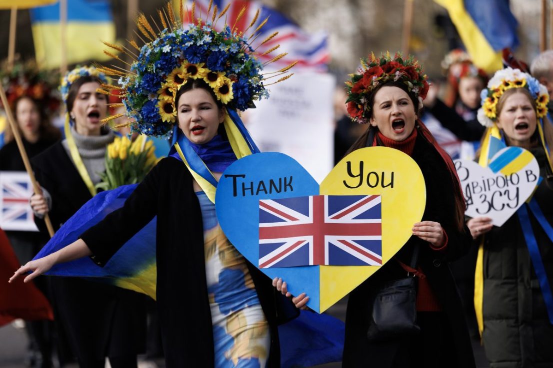LONDON, ENGLAND - FEBRUARY 24: People with placards and Ukrainian flags participate in a march to mark 2 years since the beginning of the Russian invasion of Ukraine on February 24, 2024 in London, United Kingdom. (Photo by Dan Kitwood/Getty Images)