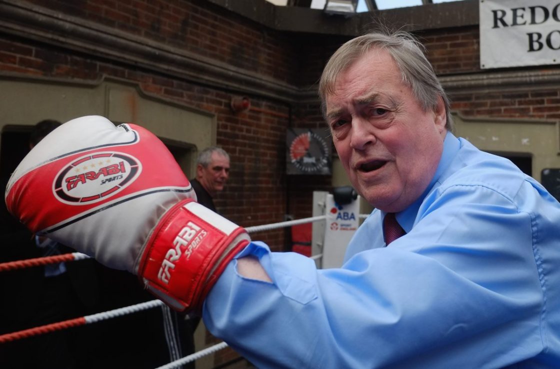 REDCAR, ENGLAND - MAY 1: Former Deputy Leader of the Labour Party and Deputy Prime Minister, Lord John Prescott poses with boxing gloves on as he joins Labour candidate Anna Turley on a visit to an Amateur Boxing Club on May 1, 2015 in Redcar, England. The visit marks the start of the final weekend of Labour's campaigning ahead of what is predicted to be the closest General Election in decades on May 7. (Photo by Ian Forsyth/Getty Images)