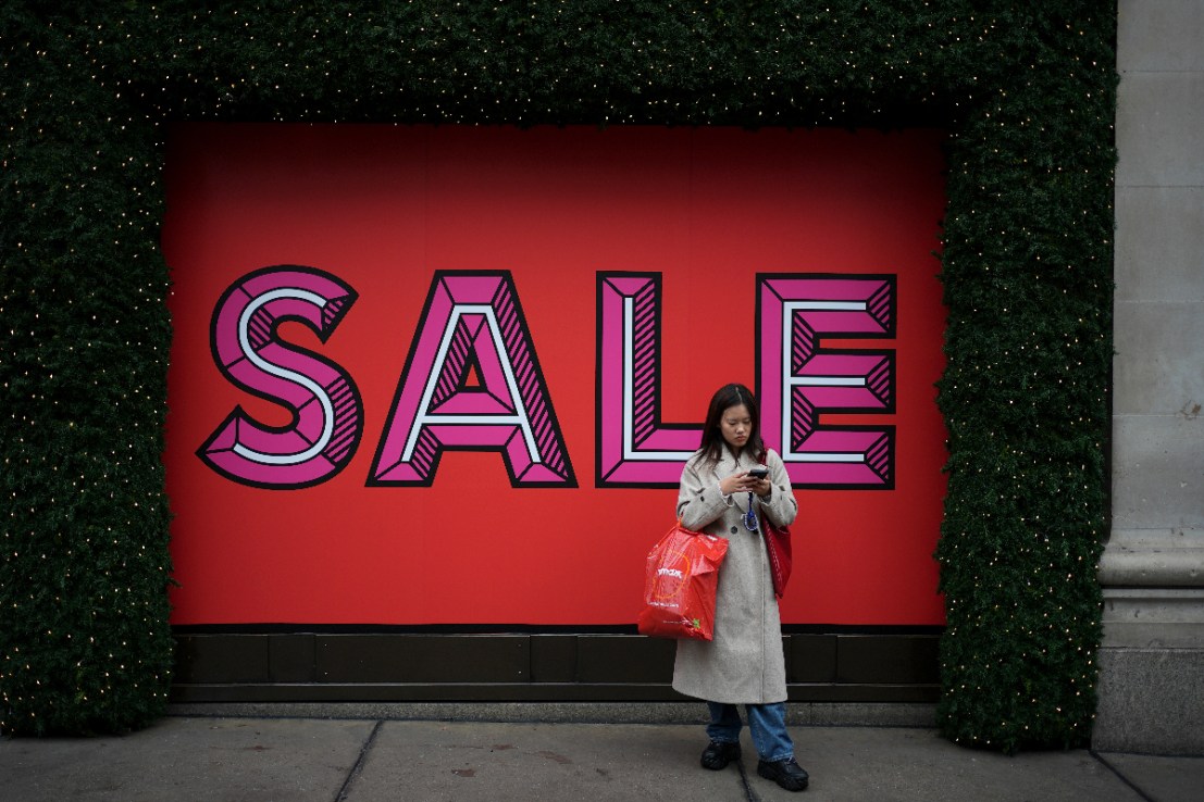 A shopper on Oxford Street, London, during the Boxing Day sales. Photo credit: Jordan Pettitt/PA Wire