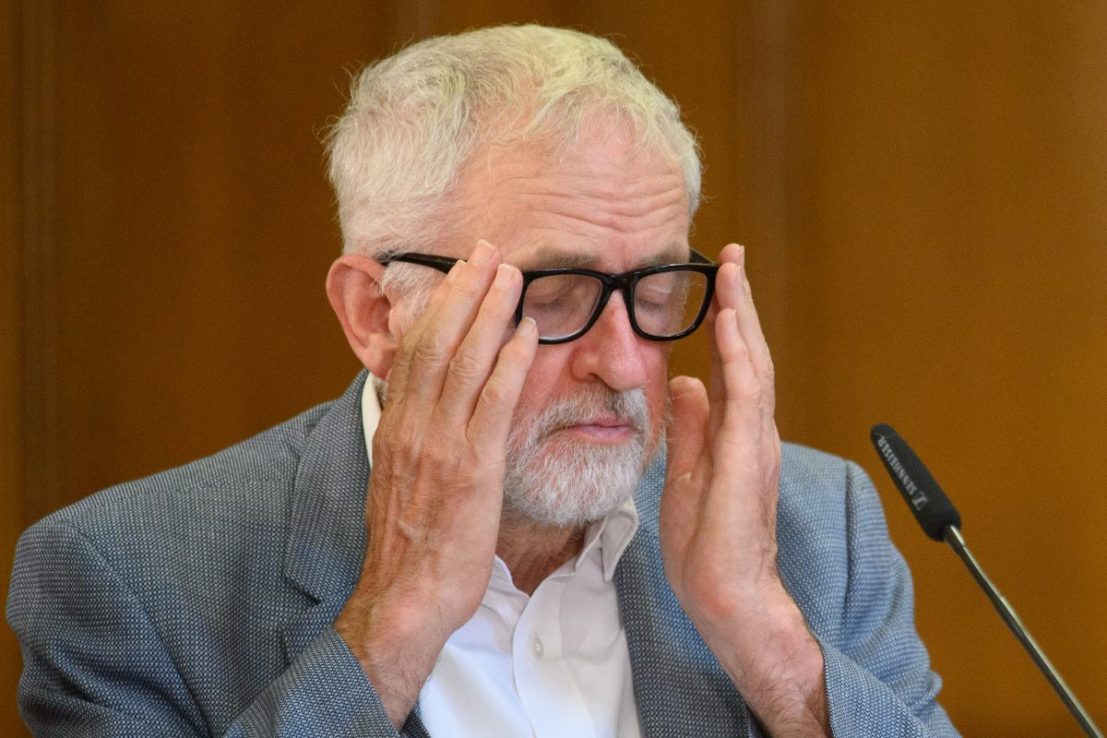 LONDON, ENGLAND - OCTOBER 22: Former Labour Party leader Jeremy Corbyn adjusts his glasses as he addresses the other speakers and audience during 