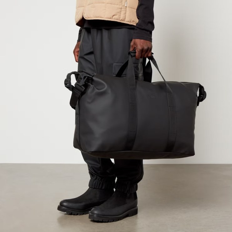 Coggles Menswear - Model holding Rains Holdall bag
