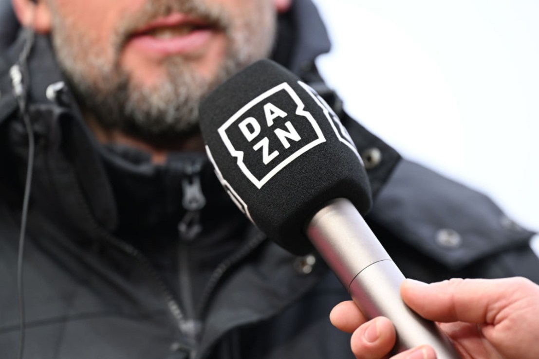 A microphone with the DAZN Logo is seen prior to the Bundesliga match between 1. FC Heidenheim 1846 and VfB Stuttgart at Voith-Arena on December 15, 2024 in Heidenheim, Germany. (Photo by Sebastian Widmann/Getty Images)