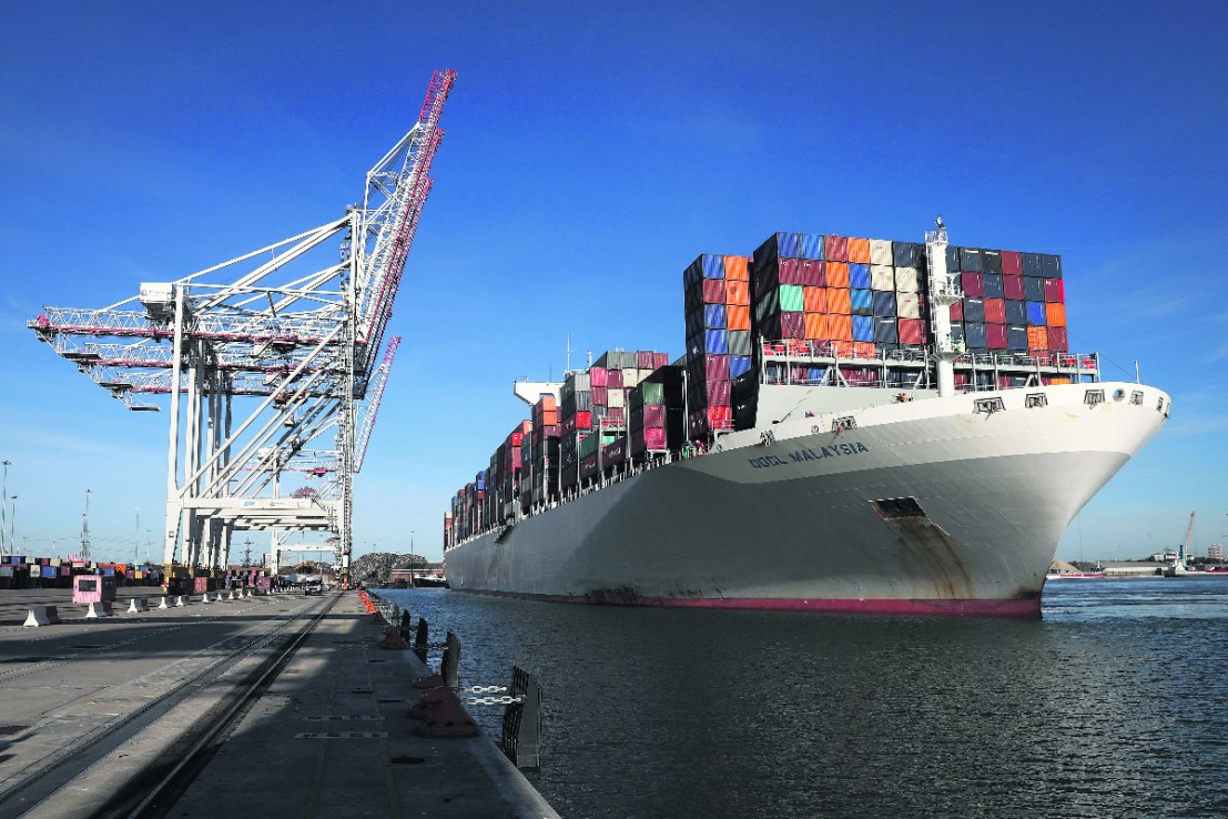 The Orient Overseas Container Line's (OOCL) Malaysia container ship, docks next to ship-to-shore cranes after arriving at the container terminal operated by DP World Ltd., at the Port of Southampton. 

Photographer: Simon Dawson/Bloomberg via Getty Images