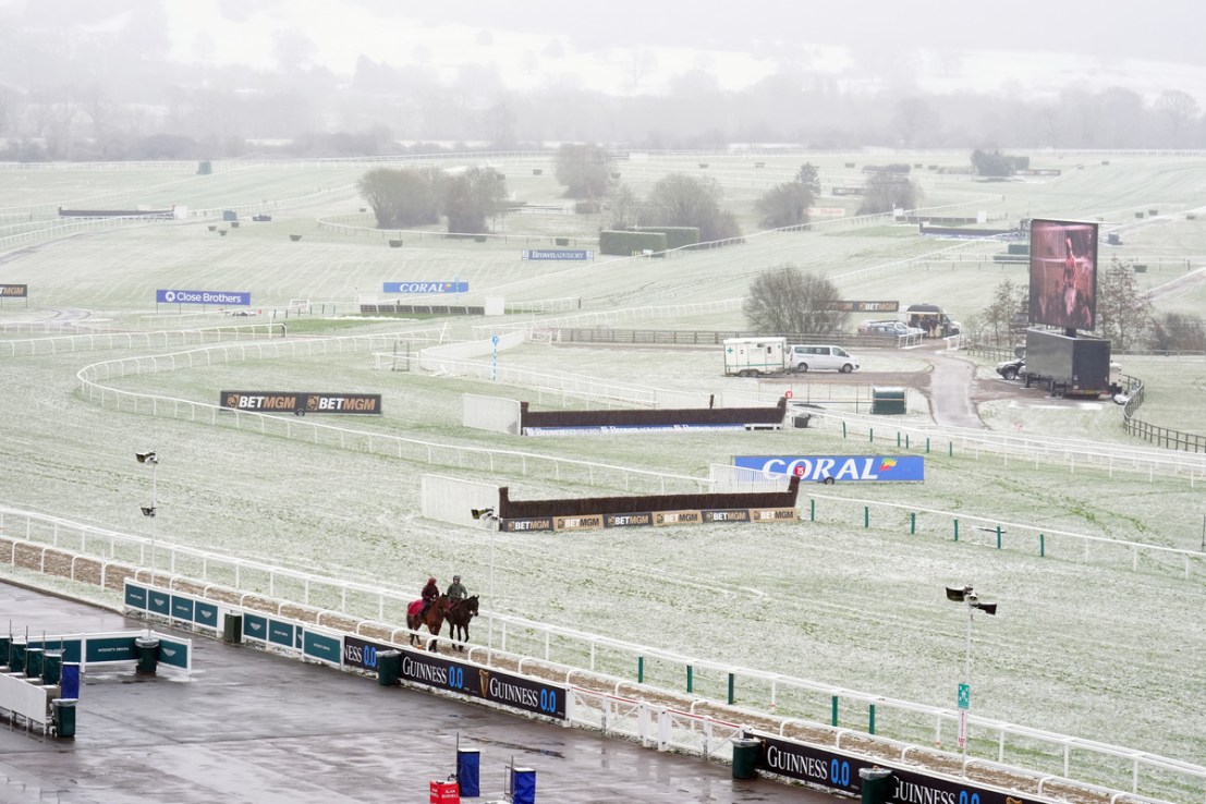 Cheltenham was hit by snow on Wednesday morning ahead of the second day's racing at the festival (Image: PA)