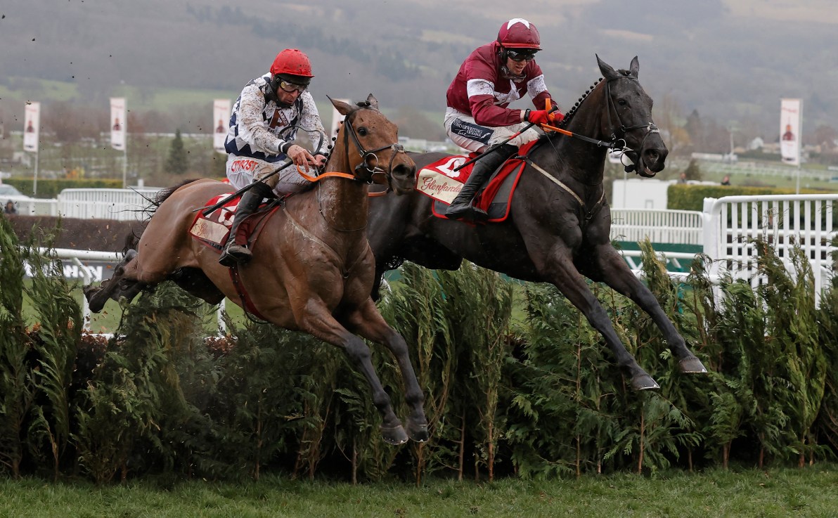 Galvin (nearside) jumps alongside Delta Work in the 2023 Cross Country Chase.