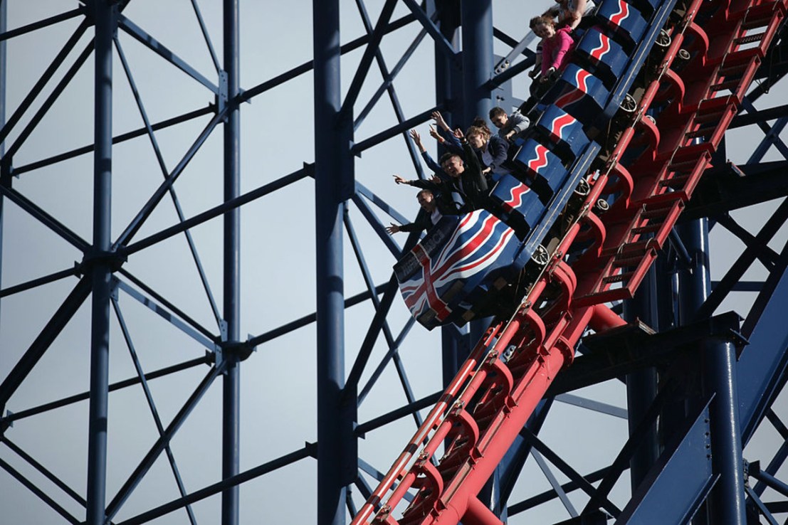 People ride a Rollercoaster at Blackpool Pleasure Beach. (Photo by Dan Kitwood/Getty Images)