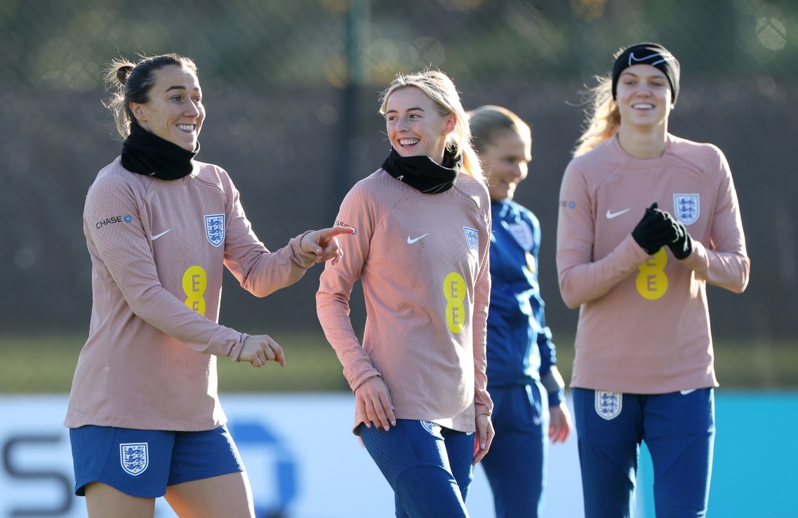 TEDDINGTON, ENGLAND - NOVEMBER 29: Lucy Bronze and Chloe Kelly of England react during a training session at The Lensbury on November 29, 2024 in Teddington, England.  (Photo by Eddie Keogh/Getty Images)