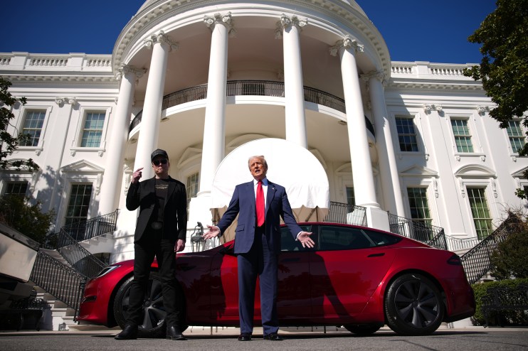 WASHINGTON, DC - MARCH 11: U.S. President Donald Trump and White House Senior Advisor, Tesla and SpaceX CEO Elon Musk deliver remarks next to a Tesla Model S on the South Lawn of the White House on March 11, 2025 in Washington, DC. Trump spoke out against calls for a boycott of Elon Musk’s companies and said he would purchase a Tesla vehicle in what he calls a ‘show of confidence and support’ for Elon Musk. (Photo by Andrew Harnik/Getty Images)