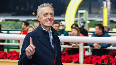 Trainer Mark Newnham celebrating with My Wish after winning the Group Two Sha Tin Trophy, showcasing his stables success.