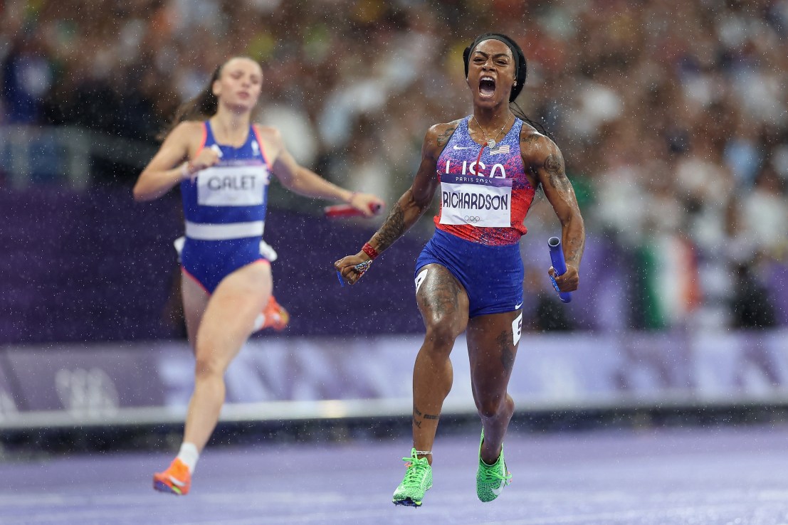 PARIS, FRANCE - AUGUST 09: Sha'carri Richardson of Team United States celebrates winning the gold medals after competing in the Women's 4x100m Relay Final on day fourteen of the Olympic Games Paris 2024 at Stade de France on August 09, 2024 in Paris, France. (Photo by Christian Petersen/Getty Images)