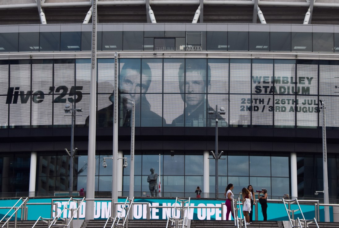 Screens at Wembley Stadium advertise the forthcoming gigs by Oasis. (Photo by Vuk Valcic/SOPA Images/LightRocket via Getty Images)