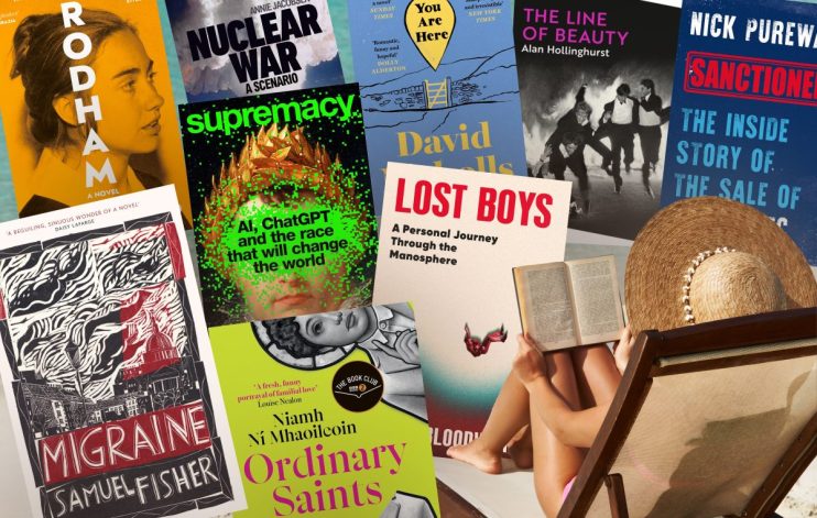 Summer reads: Young woman reading a book at the beach