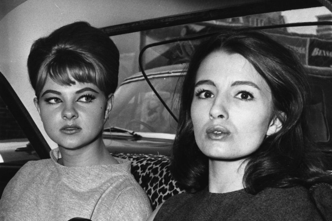 27th July 1963:  Mandy Rice-Davies (1944 - ) who rose to fame for her part in the 'Profumo Affair' sits in a car with Christine Keeler (1942 - ) who is also a model and show girl after the first day's hearing at the Old Bailey in the trial of Stephen Ward.  (Photo by Keystone/Getty Images)