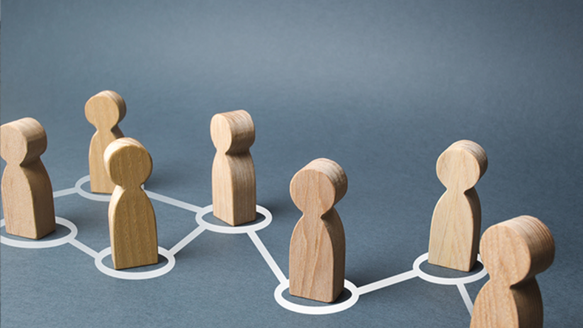 Executive MBA students engaging in collaborative discussion at Bayes Business School, fostering lifelong professional netw...