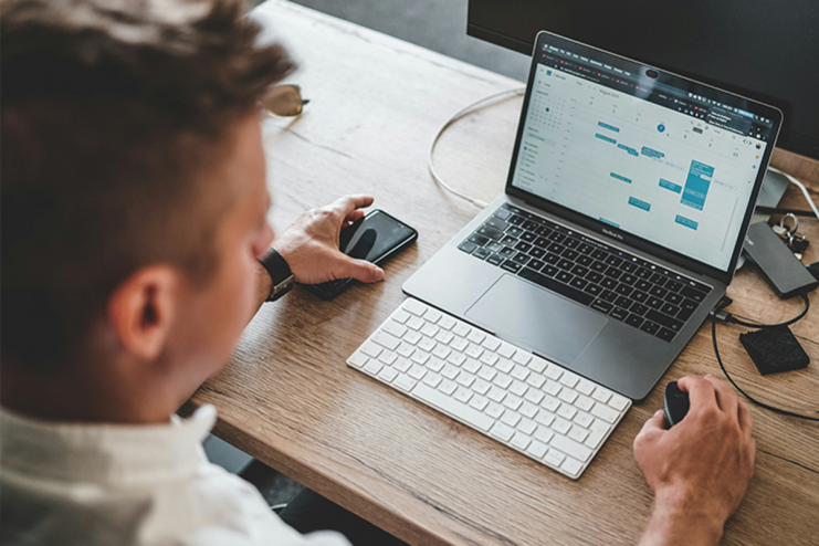 Executive balancing MBA studies with full-time job at Bayes Business School, illustrating career advancement and education