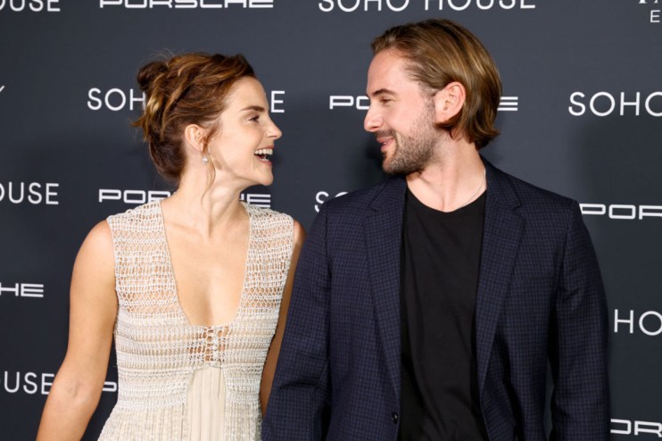 GettyImages 1666511839 showing a business meeting with diverse professionals engaged in discussion around a conference table
