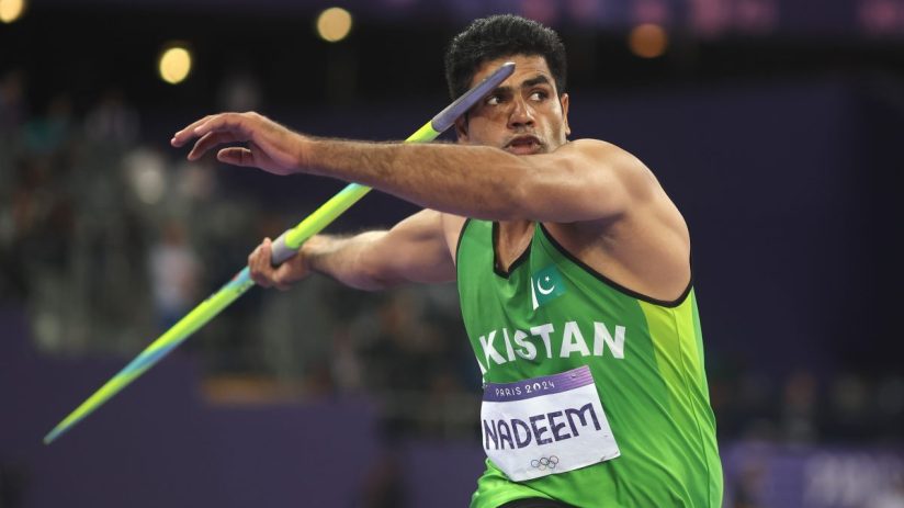 Business professionals discussing financial strategies in a modern office, representing corporate collaboration and innova...