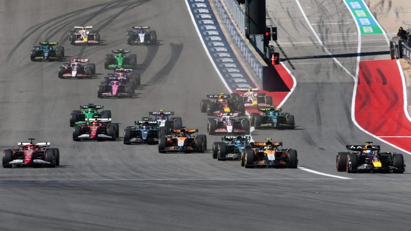 Getty Images 2242054434 shows business professionals in a conference, discussing strategies and networking in a modern off...