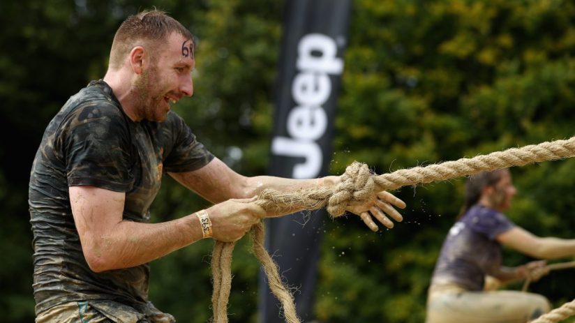 City skyline at dusk with skyscrapers illuminated, reflecting urban development trends and economic growth dynamics.