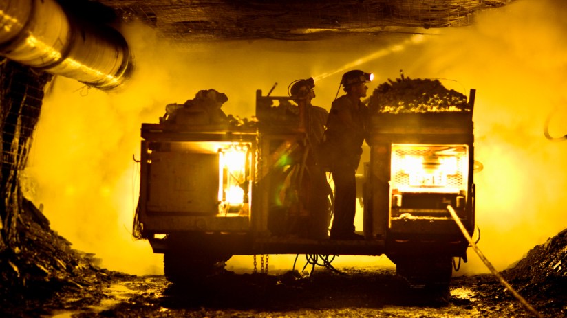 Two coal miners in mine shaft (Credit: Tyler Tableford via Getty)