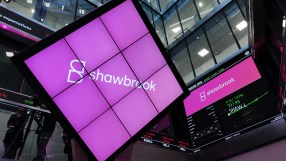 Shawbrook Bank signage outside London Stock Exchange building, highlighting financial growth and business presence in the ...