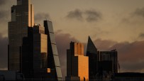 Iconic London skyline featuring the Thames River, Big Ben, and the London Eye under a clear blue sky, capturing urban vibr...