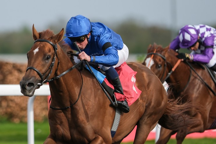 Speaker delivering a significant address at a major event, highlighting key points and engaging with an attentive audience