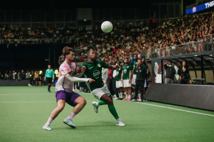 O2 Arena hosting a thrilling game event with vibrant lights and enthusiastic crowd cheering in the packed stands