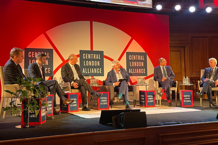 Panel discussion on Londons economy and environmental growth featuring experts and economists at a business forum