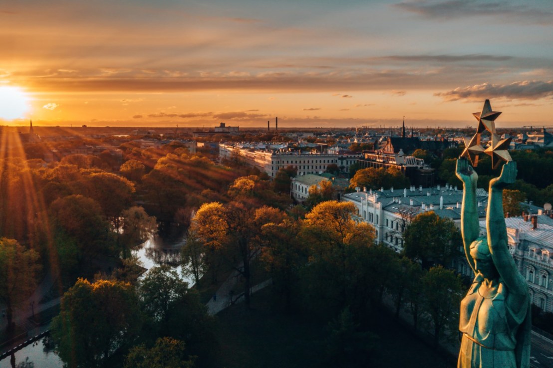 Riga cityscape featuring historic architecture, scenic skyline, and vibrant urban landscape under a clear blue sky.