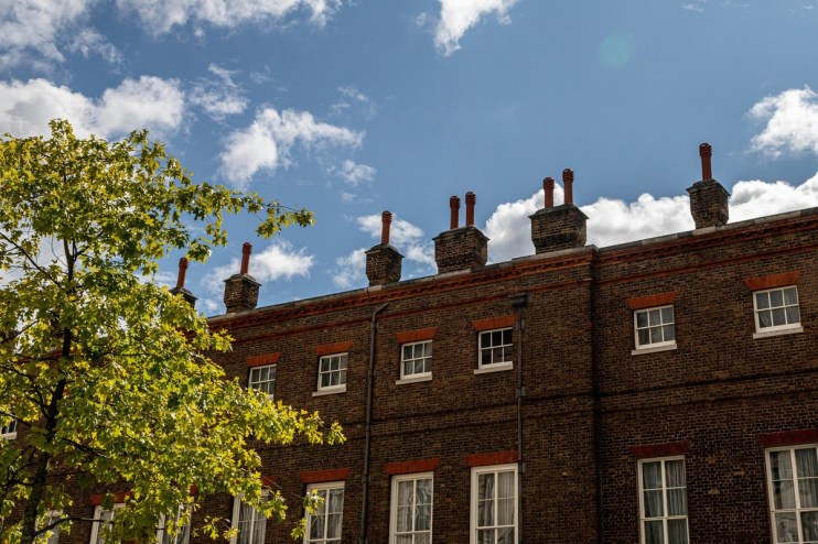 Bernd Dittrich captures a dynamic urban scene with bustling streets, showcasing vibrant city life and modern architecture.