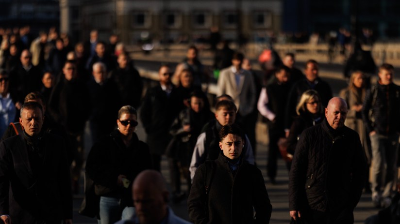 Modern suspension bridge spanning a wide river under a clear blue sky, highlighting architectural innovation and engineeri...