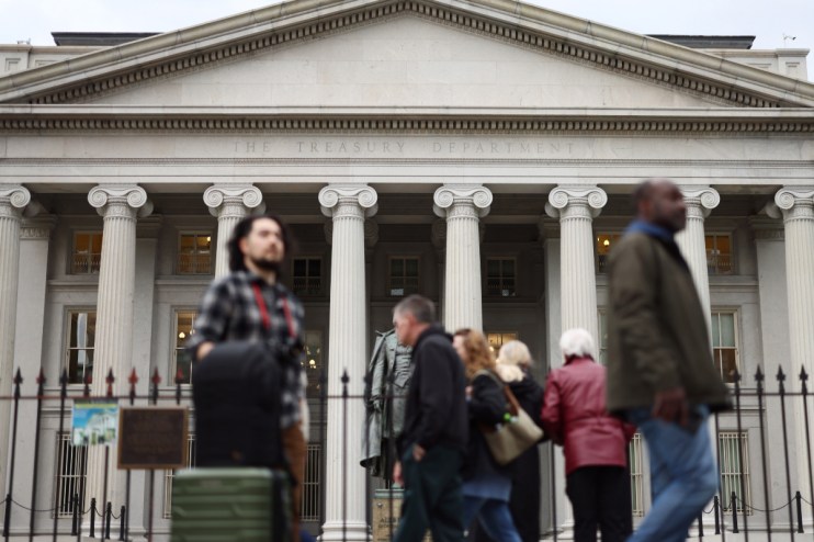 U.S. Treasury building facade with American flag, highlighting government finance and economic policy decisions