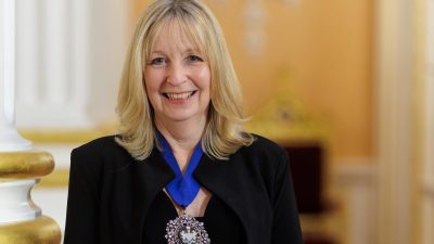 Lady Mayor Langley in official portrait, wearing formal attire, representing leadership in a professional setting