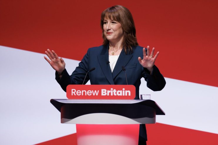 Rachel Reeves addressing economic policy at a business conference podium