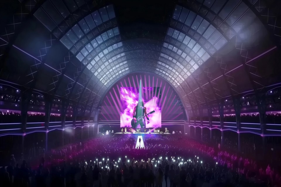 Olympia Grand Concert hall filled with audience, vibrant stage lights, and musicians performing live on a large stage