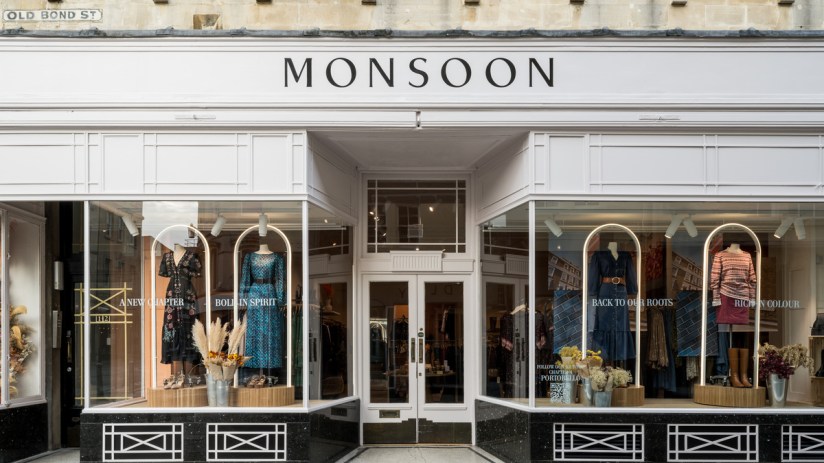 Children joyfully splash in a vibrant monsoon rain, celebrating the seasonal downpour with smiles and playful energy.