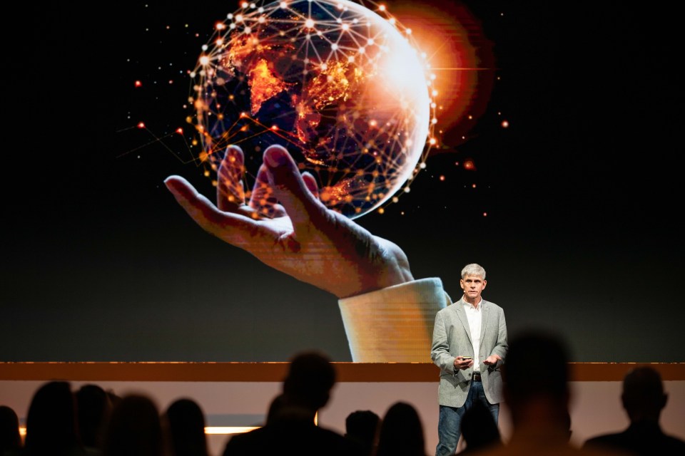 Breaking news image with a diverse group of people engaging in a lively discussion at a professional conference setting