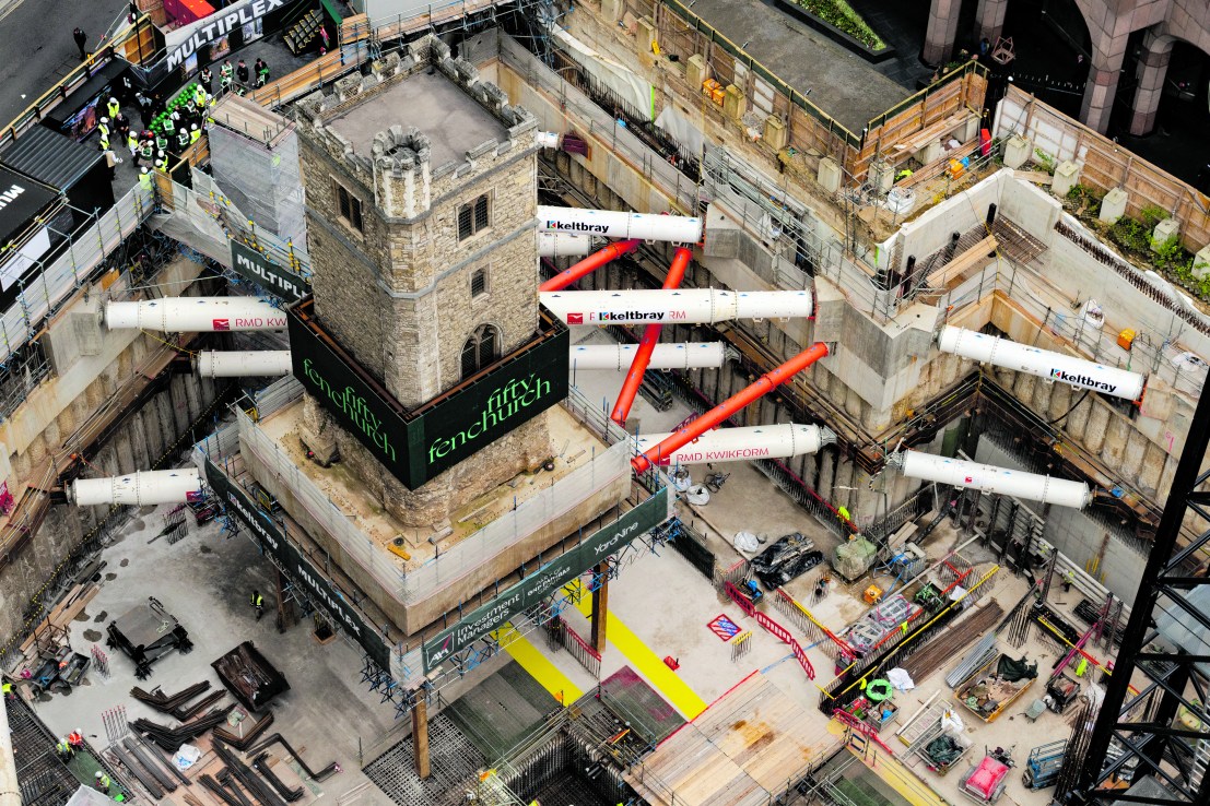 The 700-year-old tower of All Hallows Staining church is elevated on stilts during the 'Bottoming Out' ceremony of the new Fifty Fenchurch Street development in central London. Over 125,000 tonnes of earth has been removed underneath and around the medieval church tower to make way for the development of a new 650,000 sq ft 36-story office tower on the site, where the tower will form the center piece of a new public space. Picture date: Tuesday September 23, 2025. PA Photo. Photo credit should read: Jordan Pettitt/PA Wire