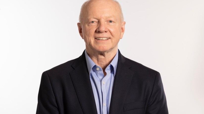 Business professional engaging in a discussion, emphasizing collaboration and strategy in a corporate setting