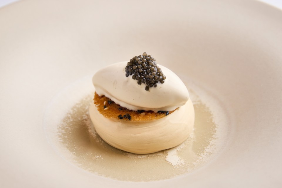 A la carte caramelised white chocolate ganache dessert elegantly presented on a plate, showcasing its rich texture and color