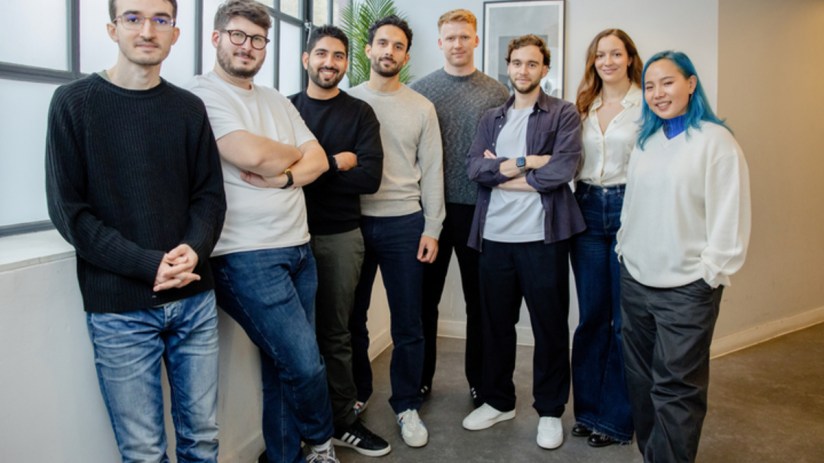 Adclear team members collaborating in a modern office setting, showcasing teamwork and innovation in business strategies