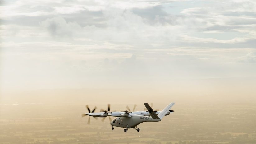 Futuristic air taxi hovering above a cityscape, showcasing innovative urban air mobility solutions and advanced technology.
