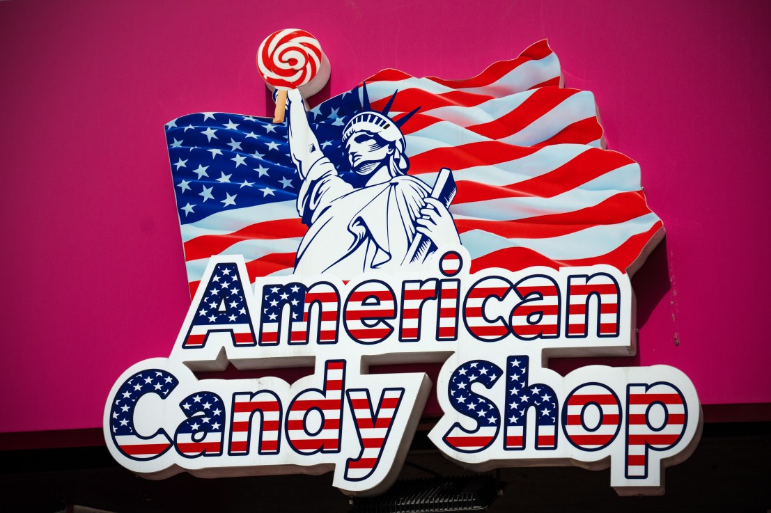 LONDON, ENGLAND - JULY 18: A logo is displayed outside an American candy store near Piccadilly Circus on July 18, 2023 in London, England. The proliferation of American-style candy stores in Oxford Street and the surrounding area began in 2017 and increased significantly during the Covid-19 pandemic when well-known shop chains closed down leaving buildings empty. Landlords moved them in rent-free hoping they would pay business rates but many have been prosecuted for non-payment. More recently, trading standards and police have targeted many of the shops and confiscated thousands of pounds worth of counterfeit and dangerous goods. Westminster City Council wrote to the landlords in May begging them to do “all that they can” to bring the influx of the stores to an end. (Photo by Carl Court/Getty Images)
