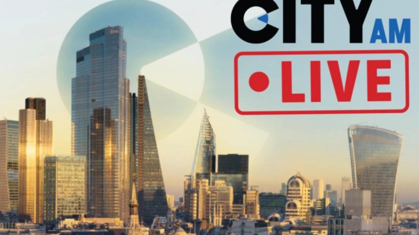 City AM live blog updates on latest news and business events in an urban setting with bustling streets and skyscrapers