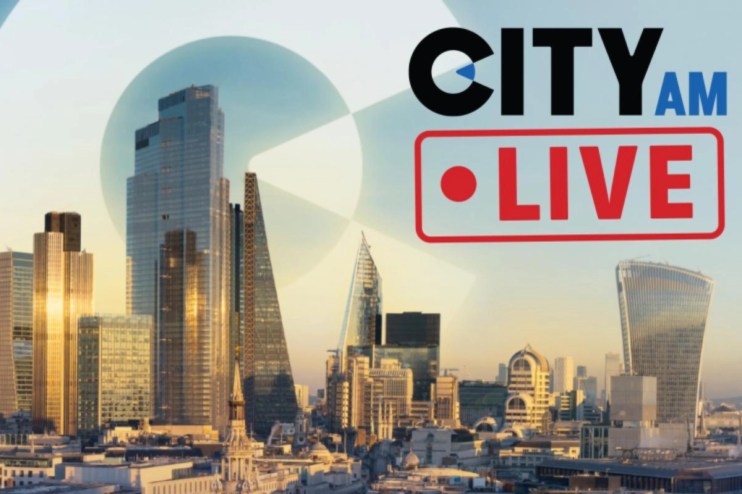 City AM live blog updates on latest news and business events in an urban setting with bustling streets and skyscrapers