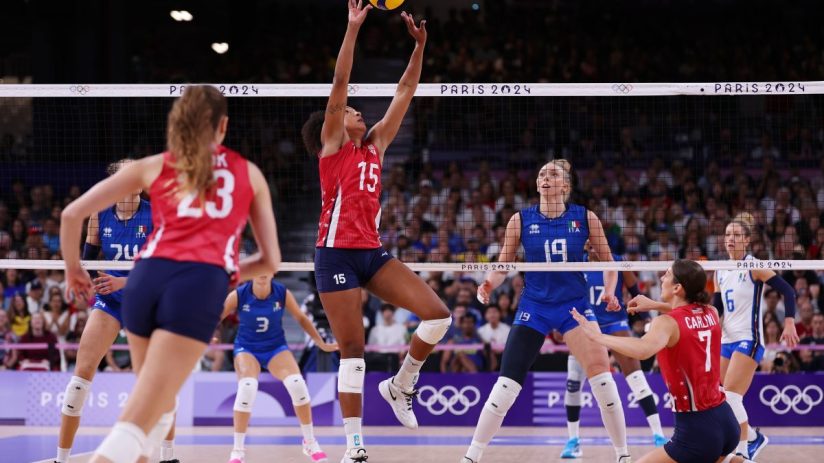 GettyImages 2166302263 showcases a dynamic business meeting with professionals discussing strategy around a conference table.