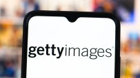 Getty Images logo displayed on a smartphone screen against a blurred background, representing digital media content.